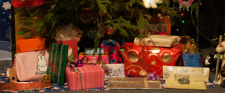 Christmas gifts under the tree by ahenobarbus via Flickr (cropped)